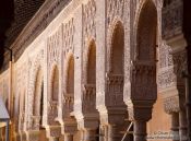 Travel photography:Arches in the Patio de los Leones (Court of the Lions) of the Nazrin palace in the Granada Alhambra, Spain