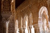 Travel photography:Arches in the Patio de los Leones (Court of the Lions) of the Nazrin palace in the Granada Alhambra, Spain