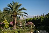 Travel photography:Park and gardens of the Generalife of the Granada Alhambra with the Sierra Nevada in the background, Spain