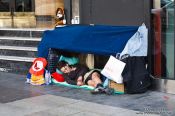 Travel photography:Homeless person on the Gran Via in Madrid, Spain