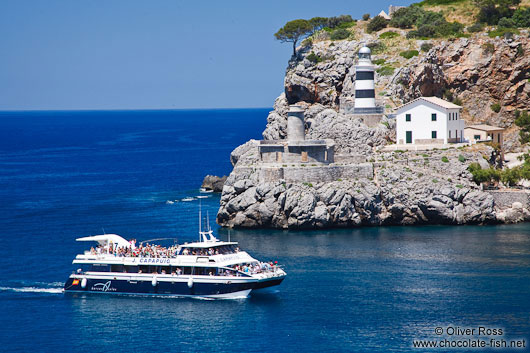 Port de Soller light house and tourist boat