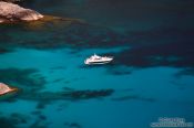 Travel photography:Anchored boat in a bay near Cap Formentor, Spain