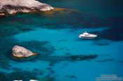 Travel photography:Anchored boat in a bay near Cap Formentor, Spain