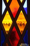 Travel photography:Detail of a stained glass door Valldemossa Cartuja Carthusian monastery, Spain