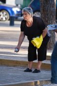 Travel photography:Woman playing boules in Palma, Spain