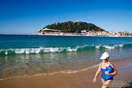 Taking a walk on la Concha beach in San Sebastian