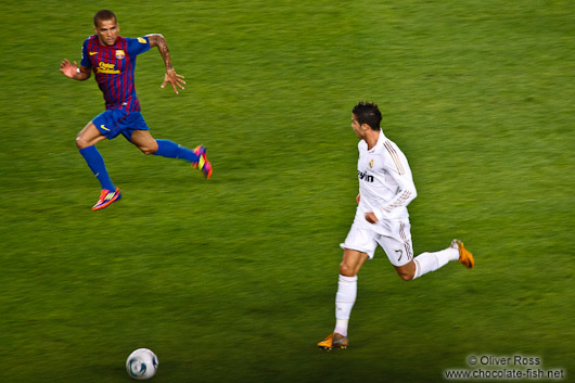 Cristiano Ronaldo pursued by Daniel Alves
