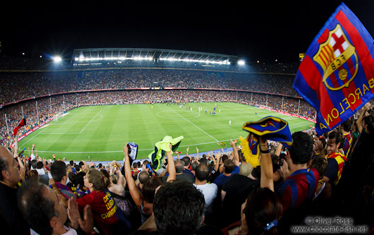 Spectators celebrate the victory of the Supercup 2011 by the FC Barcleona in their home stadium in Camp Nou