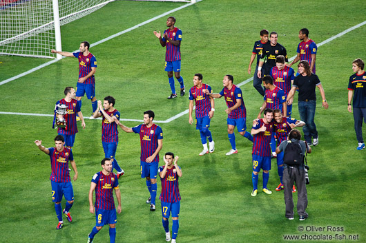 The team of FC Barcelona on their victory lap after winning the Supercup 2011