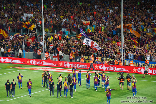 The team of FC Barcelona on their victory lap after winning the Supercup 2011