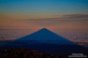 Travel photography:Triangular shadow of Teide Volcano viewed at sunrise from the summit, Spain