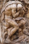 Travel photography:Alabaster Atlas at the entrance to the Palau del Marqués de Dosaigües in Valencia, Spain