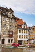 Travel photography:Houses with fountain in Sankt Gallen , Switzerland