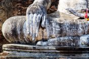 Travel photography:Giant Buddha with Earth touching pose at the Sukhothai temple complex, Thailand