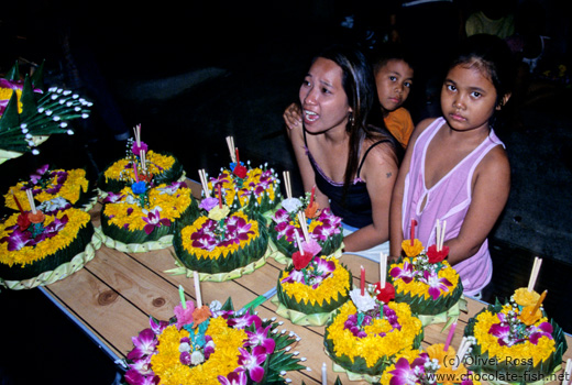 Selling the flower floats for the Loi Krathong festival.