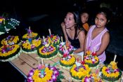 Travel photography:Selling the flower floats for the Loi Krathong festival., Thailand