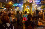 Travel photography:Worshippers at a shrine in Bangkok´s Silom district, Thailand