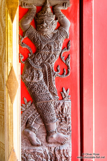 Sculpture in a window shutter at Wat Benchamabophit in Bangkok