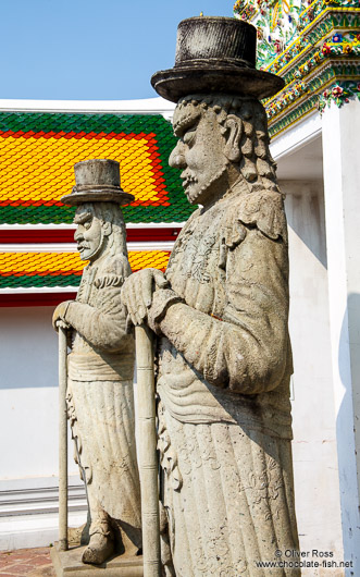 Stone guardians at Wat Pho temple in Bangkok