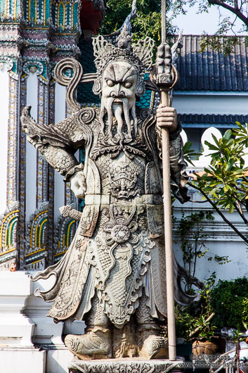 Stone guardian at Wat Pho temple in Bangkok