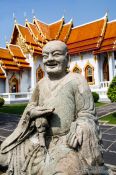 Travel photography:Buddha sculpture outside the marble temple Wat Benchamabophit in Bangkok, Thailand