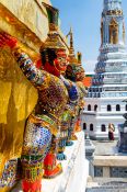 Travel photography:Golden demon sculptures at Wat Phra Kaew, the Bangkok Royal Palace, Thailand