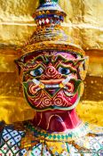 Travel photography:Golden demon sculpture at Wat Phra Kaew, the Bangkok Royal Palace, Thailand