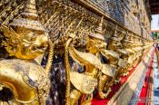 Travel photography:Golden Garuda sculptures at Wat Phra Kaew, the Bangkok Royal Palace, Thailand