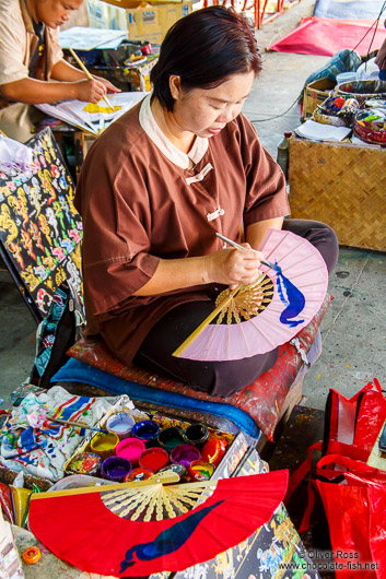 Woman painting a fan at the Bo Sang parasol factory