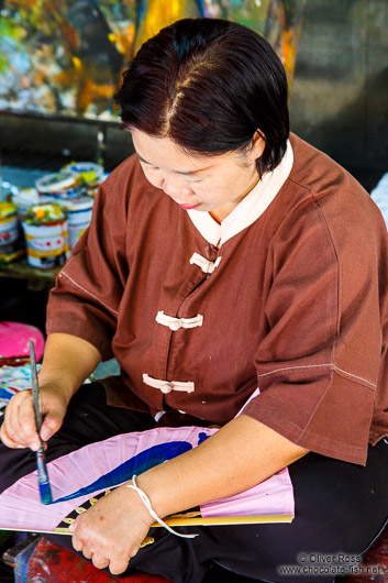 Woman painting a fan at the Bo Sang parasol factory