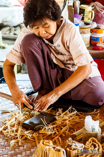 Woman cutting pieces for a parasol at the Bo Sang parasol factory