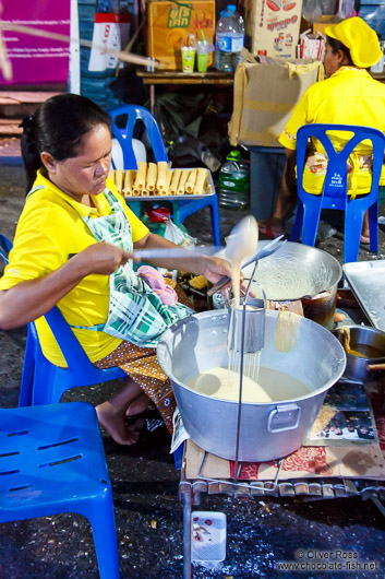 Preparing food at a street stall in Trang