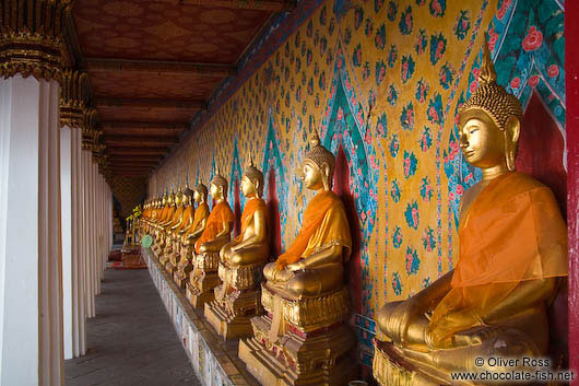 Row of golden Buddhas inside Bangkok´s Wat Arun 