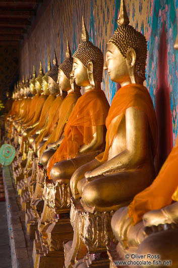 Row of golden Buddhas inside Bangkok´s Wat Arun 