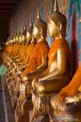 Travel photography:Row of golden Buddhas inside Bangkok´s Wat Arun , Thailand