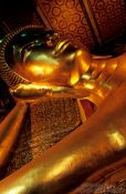 Travel photography:Giant reclining Buddha at Wat Pho, face detail., Thailand