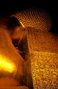 Travel photography:The neck part of the giant reclining Buddha at Wat Pho, Thailand