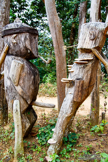 Wooden guardians at the entrance gate to the Ban Lorcha Akha village