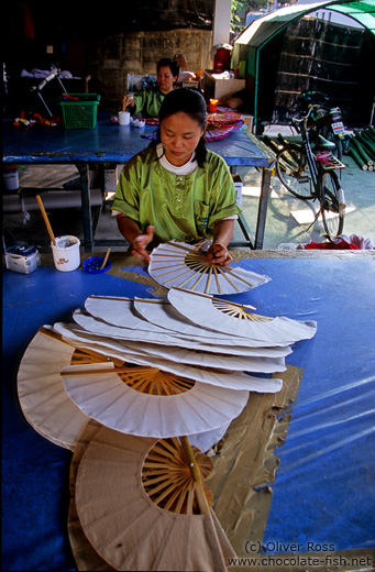 Woman making hand fans at the Bo Sang parasol factory