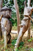 Travel photography:Wooden guardians at the entrance gate to the Ban Lorcha Akha village, Thailand