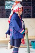 Travel photography:Woman in traditional dress at the Ban Lorcha Akha village, Thailand