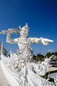 Travel photography:Guardian at the Chiang Rai Silver Temple, Thailand