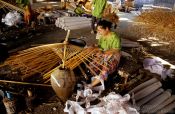 Travel photography:Woman making a parasol at the Bo Sang parasol factory, Thailand