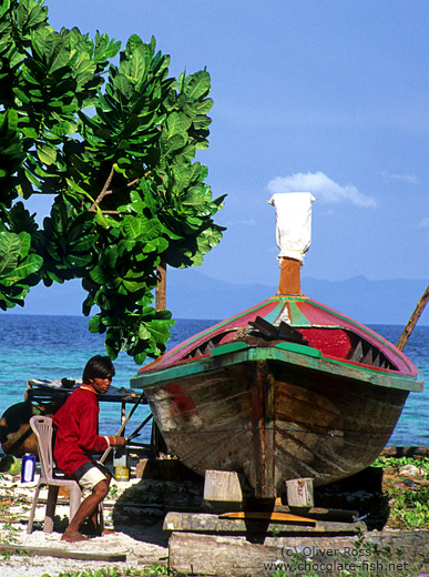 Chao Leh repairing his boat on Ko Lipe