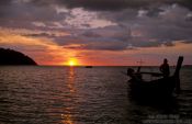 Travel photography:Sunset with Chao Leh longtail boat in Ko Tarutao Ntl Park, Thailand