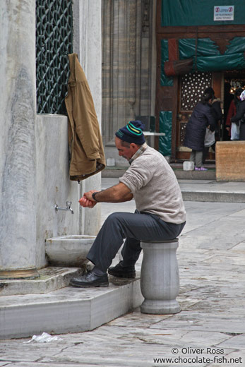 Ritual cleansing before the Friday prayer outside Yeni Mosque in Istanbul