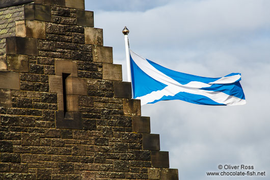 Edinburgh castle with Scottish flag