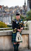 Travel photography:Edinburgh man playing the bagpipes, United Kingdom