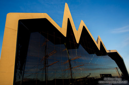 The Glasgow Riverside Museum at sunset with reflection of the Tall Ship Glenlee