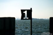 Travel photography:New York Pier Number One with Statue of Liberty, USA